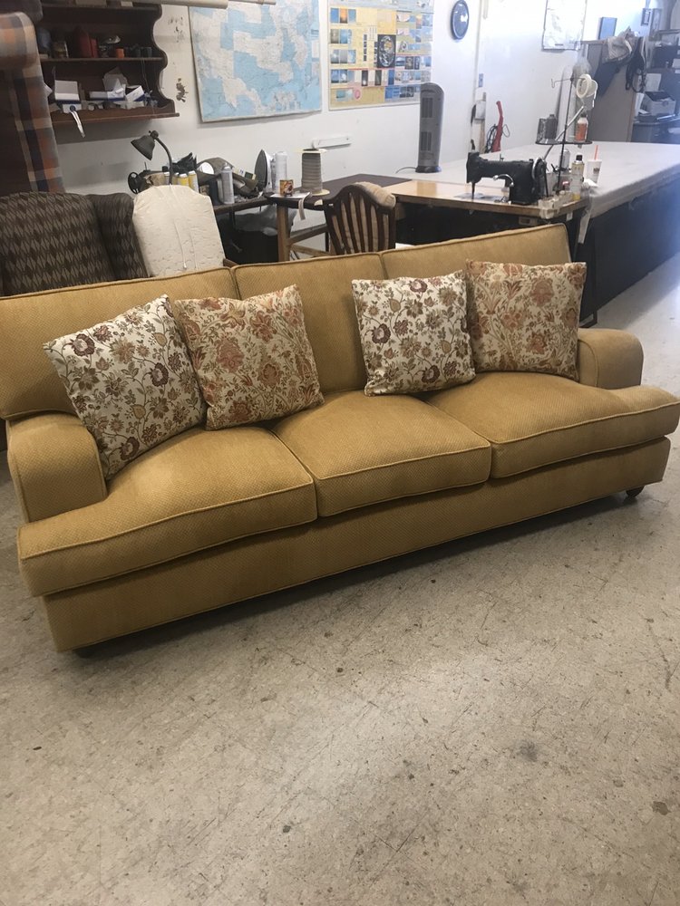 Gold Sofa with Floral Throw Pillows